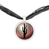 Arid Desert Cactus Silhouette Against Moon w/ Earth Red Swirl Background Pendant Necklace in Silver Tone