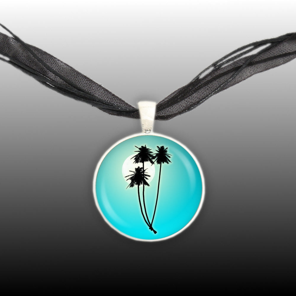 Tropical Palm Trees Silhouette Against Moon w/ Caribbean Blue Background Pendant Necklace in Silver Tone