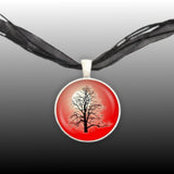 Bare Maple Tree w/o Leaves Silhouette Against Moon w/ Red Background Pendant Necklace in Silver Tone