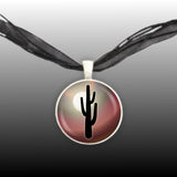 Arid Desert Cactus Silhouette Against Moon w/ Earth Red Swirl Background Pendant Necklace in Silver Tone