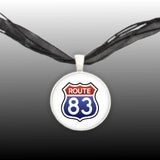 Road to Nowhere Route 83 Sign Red, White & Blue USA Travel Pendant Necklace in Silver Tone, North Dakota to Texas