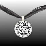 Random Foot Prints on White Background Pendant Necklace in Silver Tone