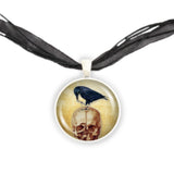Black Raven or Crow Perched on Red Skull Vintage Style Artwork 1" Pendant Chain Necklace in Silver Tone or Gold Tone
